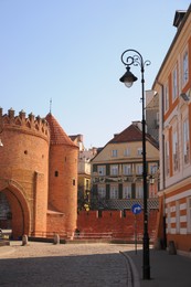 Photo of WARSAW, POLAND - MARCH 22, 2022: Beautiful view of Old Town Square on sunny day