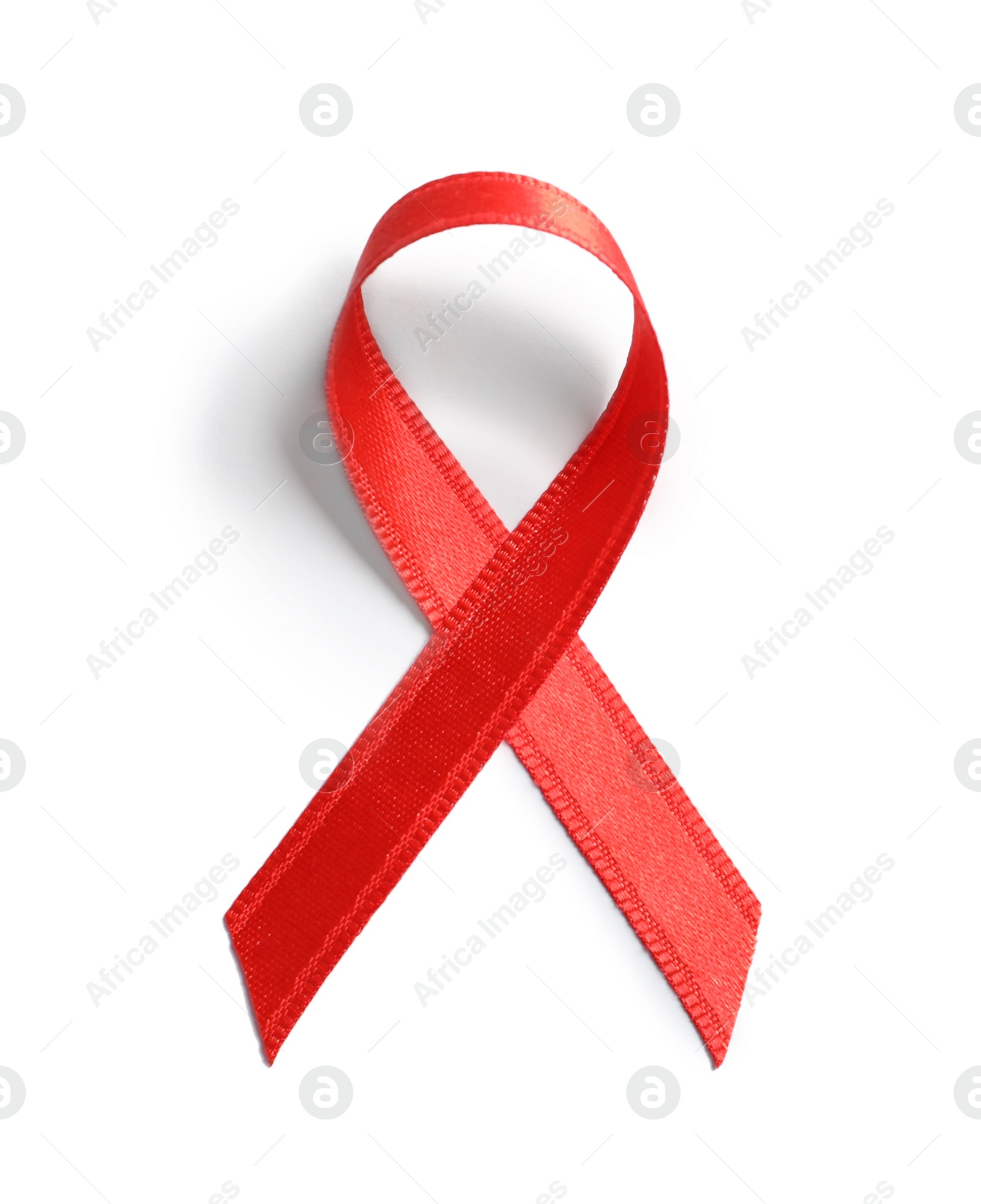 Photo of Red ribbon on white background, top view. Cancer awareness