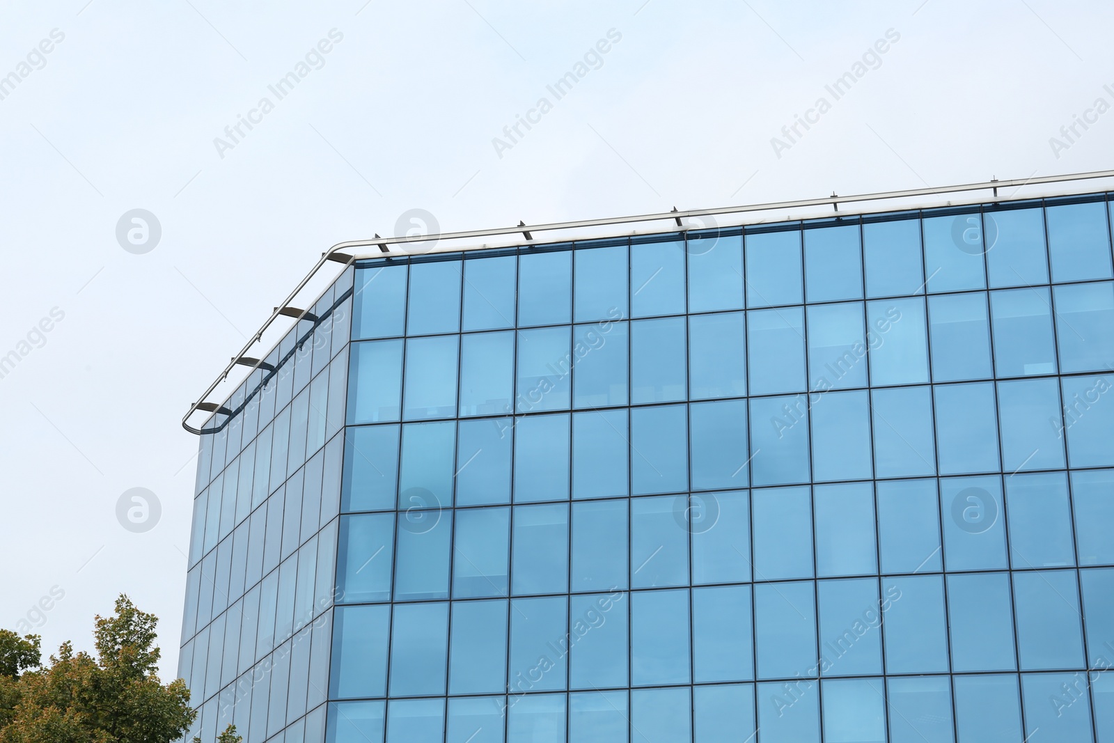 Photo of Modern building against blue sky. Urban architecture