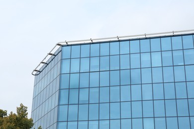 Photo of Modern building against blue sky. Urban architecture