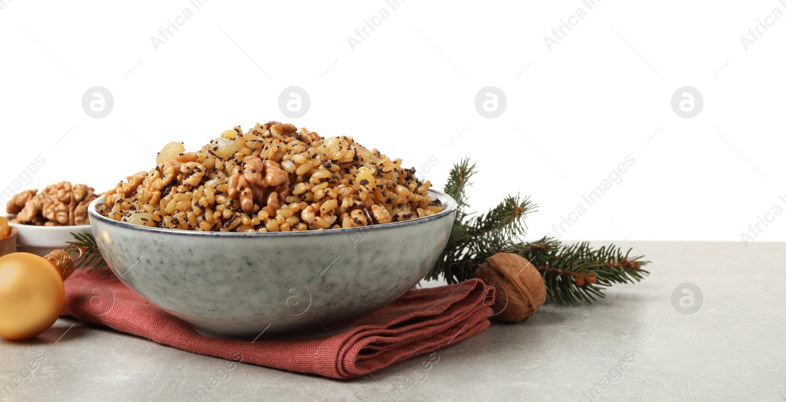Photo of Traditional Christmas slavic dish kutia on light grey table against white background