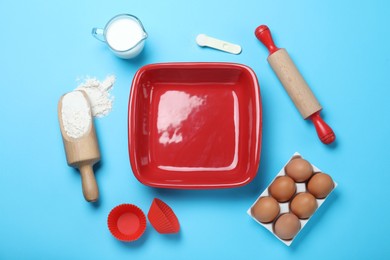 Photo of Cooking utensils and ingredients on light blue background, flat lay