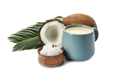 Photo of Delicious coffee with organic coconut oil and palm leaf isolated on white