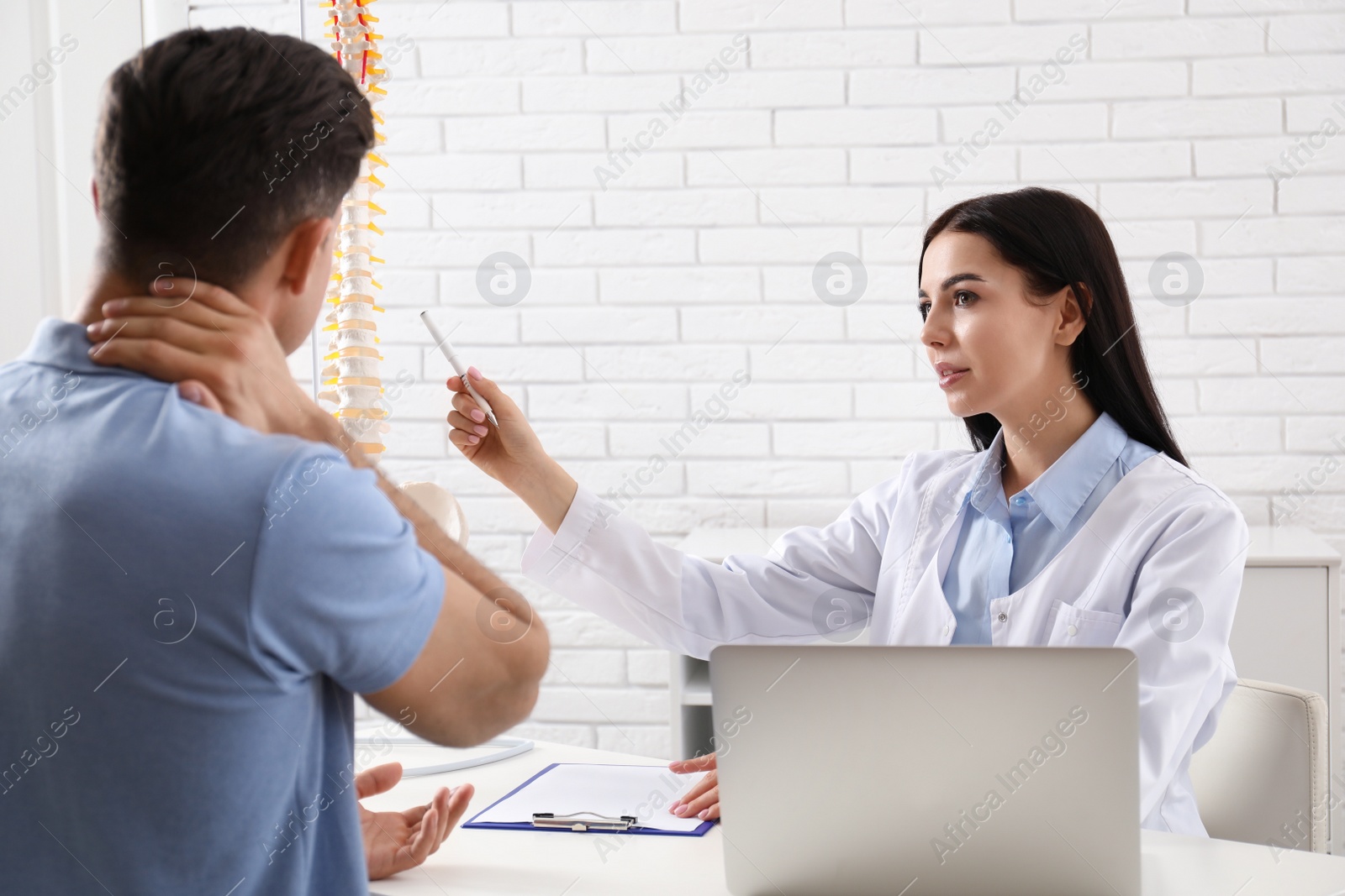 Photo of Man visiting professional orthopedist in medical office