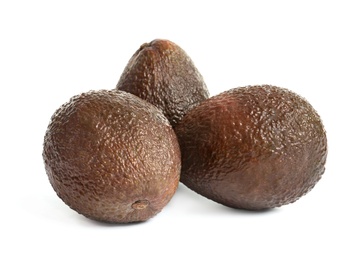 Photo of Ripe fresh avocados on white background