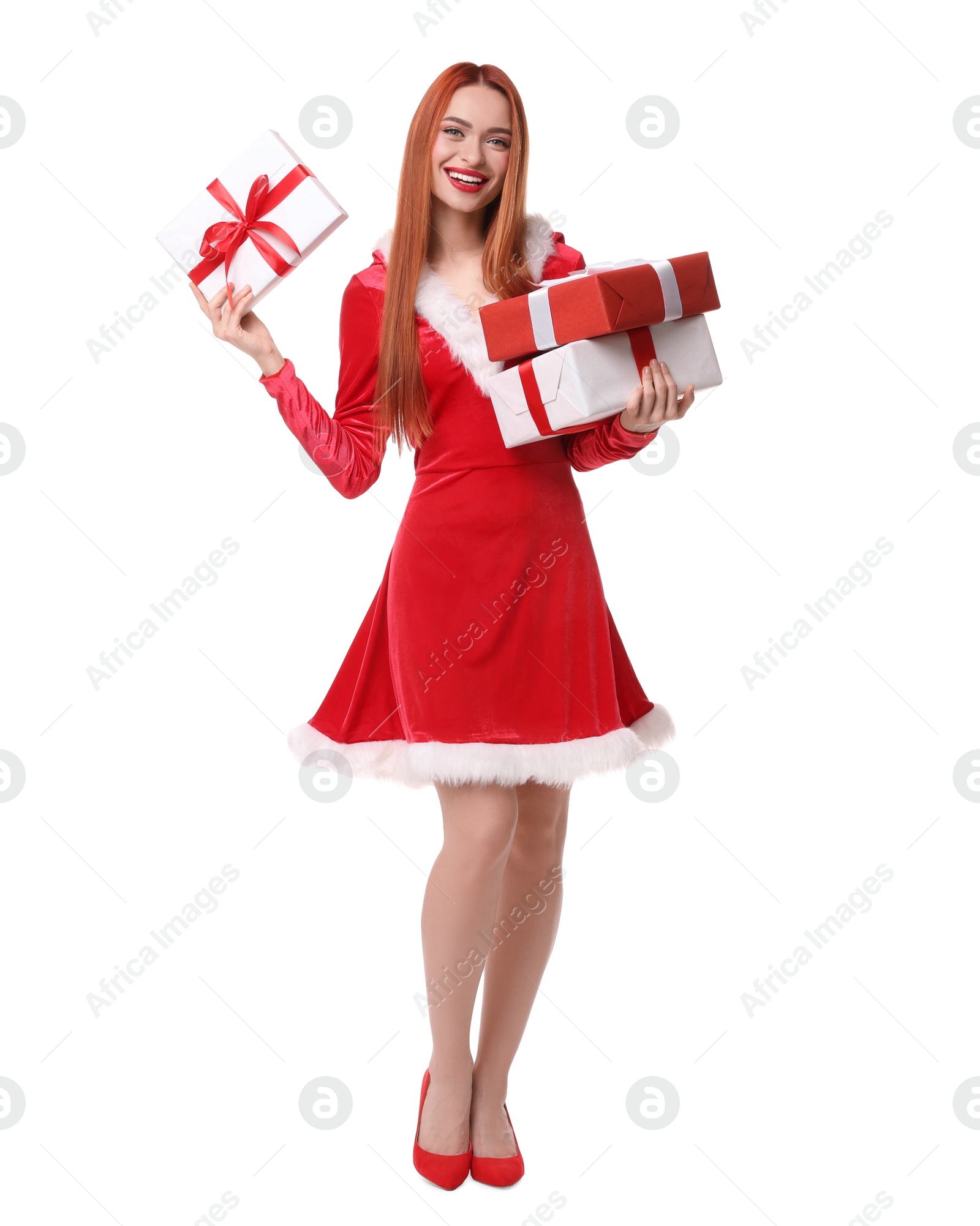 Photo of Young woman in red dress with Christmas gifts on white background