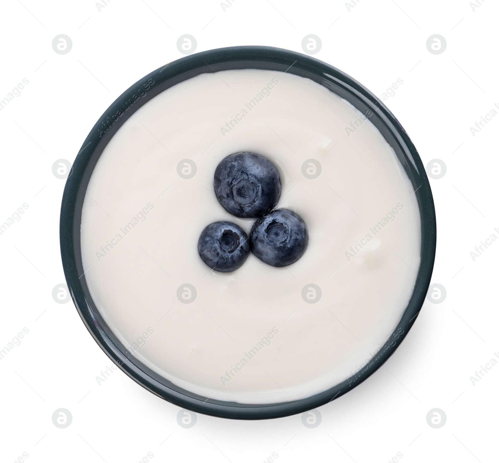 Photo of Bowl of delicious yogurt with blueberries isolated on white, top view