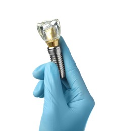 Dentist holding educational model of dental implant on white background, closeup