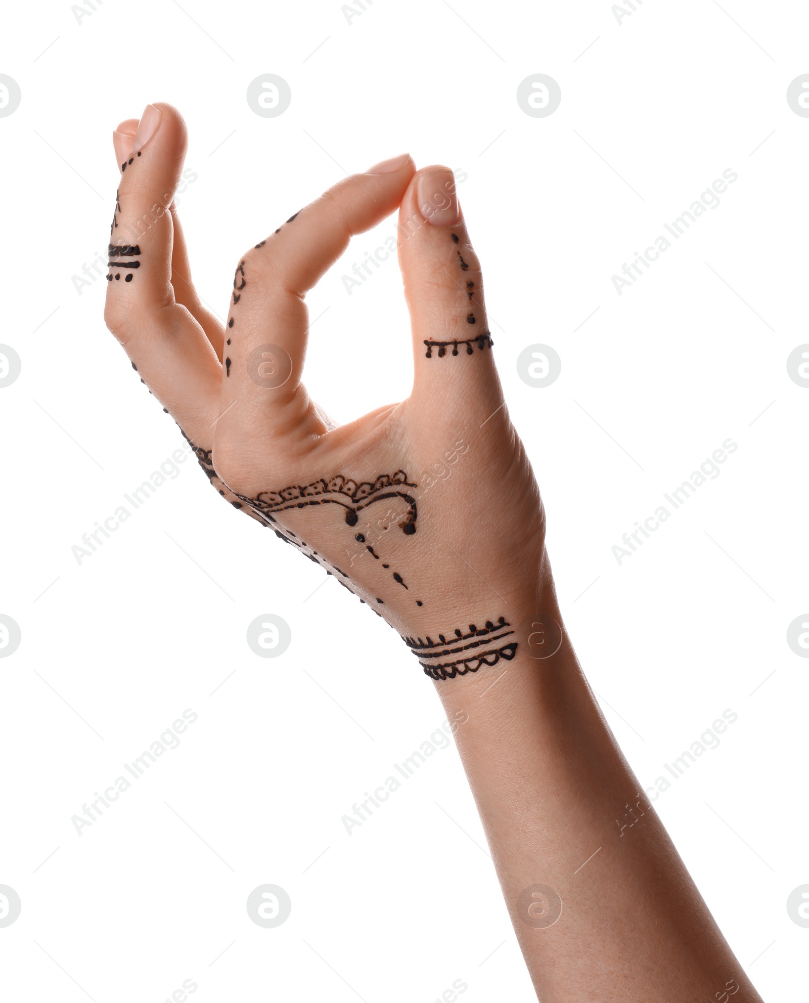 Photo of Woman with henna tattoo on hand against white background, closeup. Traditional mehndi ornament