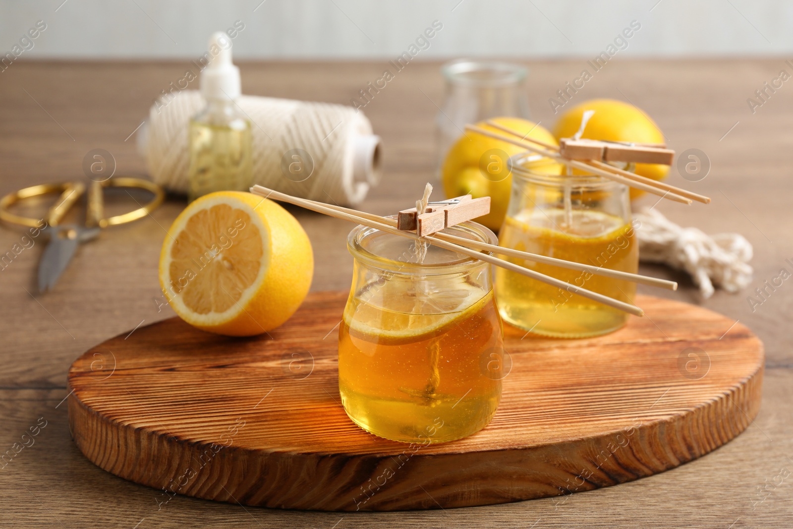 Photo of Process of making citrus candles on table