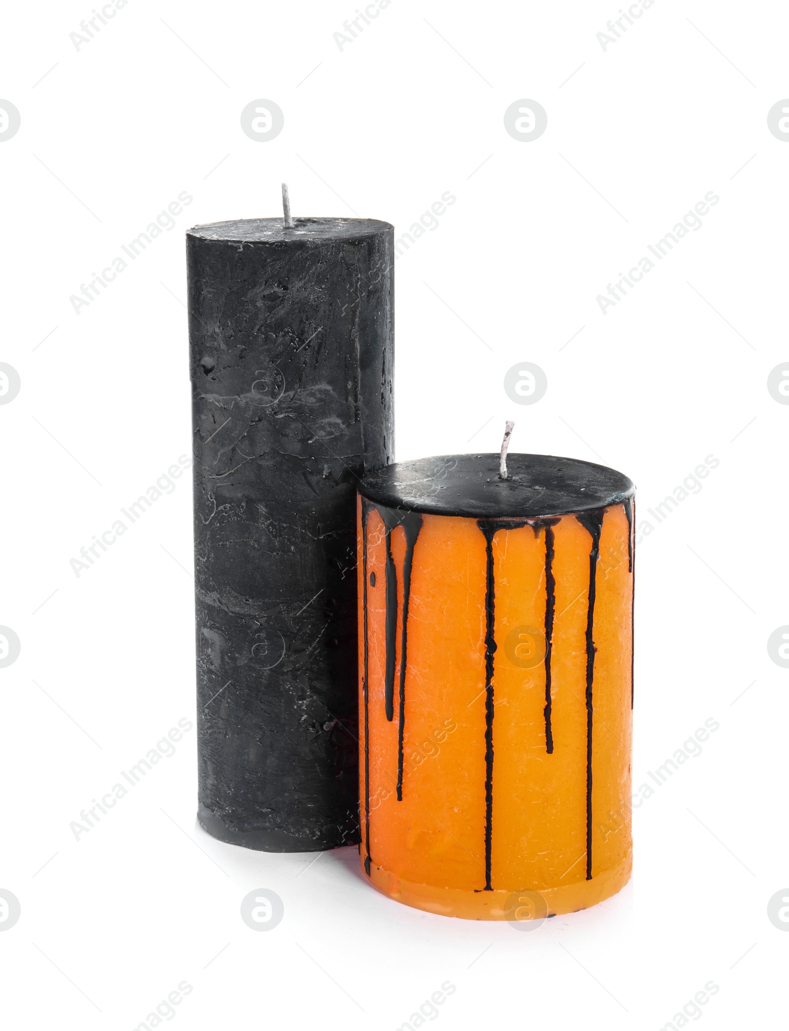 Photo of Decorative wax candles on white background. Halloween celebration