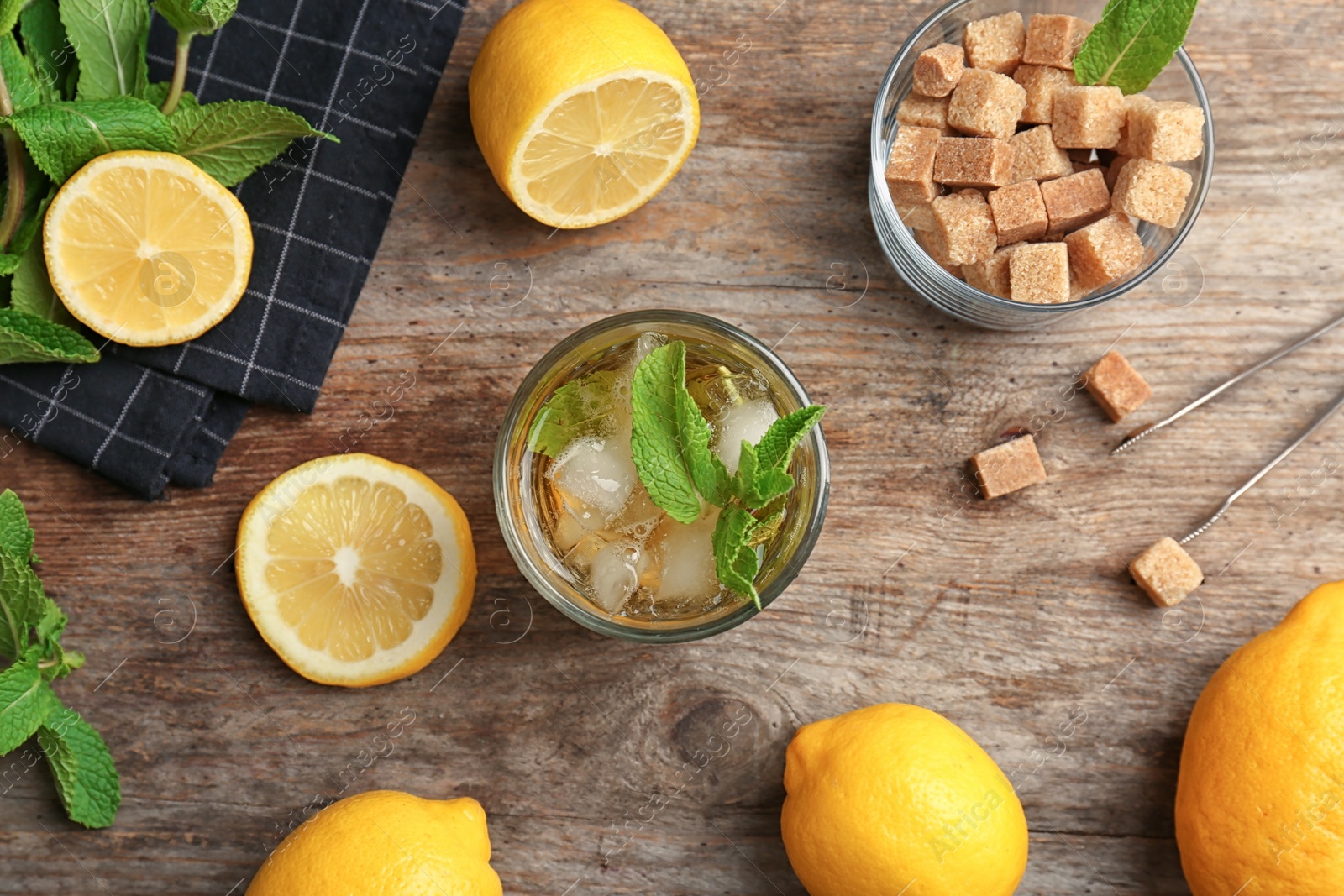 Photo of Flat lay composition with delicious mint julep cocktail on wooden background