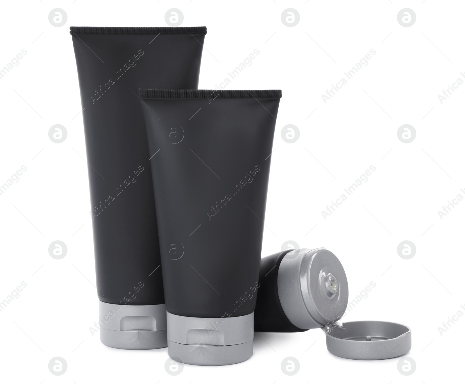 Photo of Black tubes with men's cosmetic products on white background