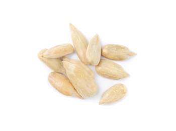 Photo of Peeled sunflower seeds on white background, top view