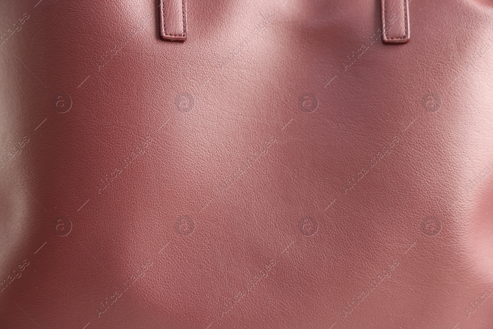 Photo of Brown leather bag as background, closeup view