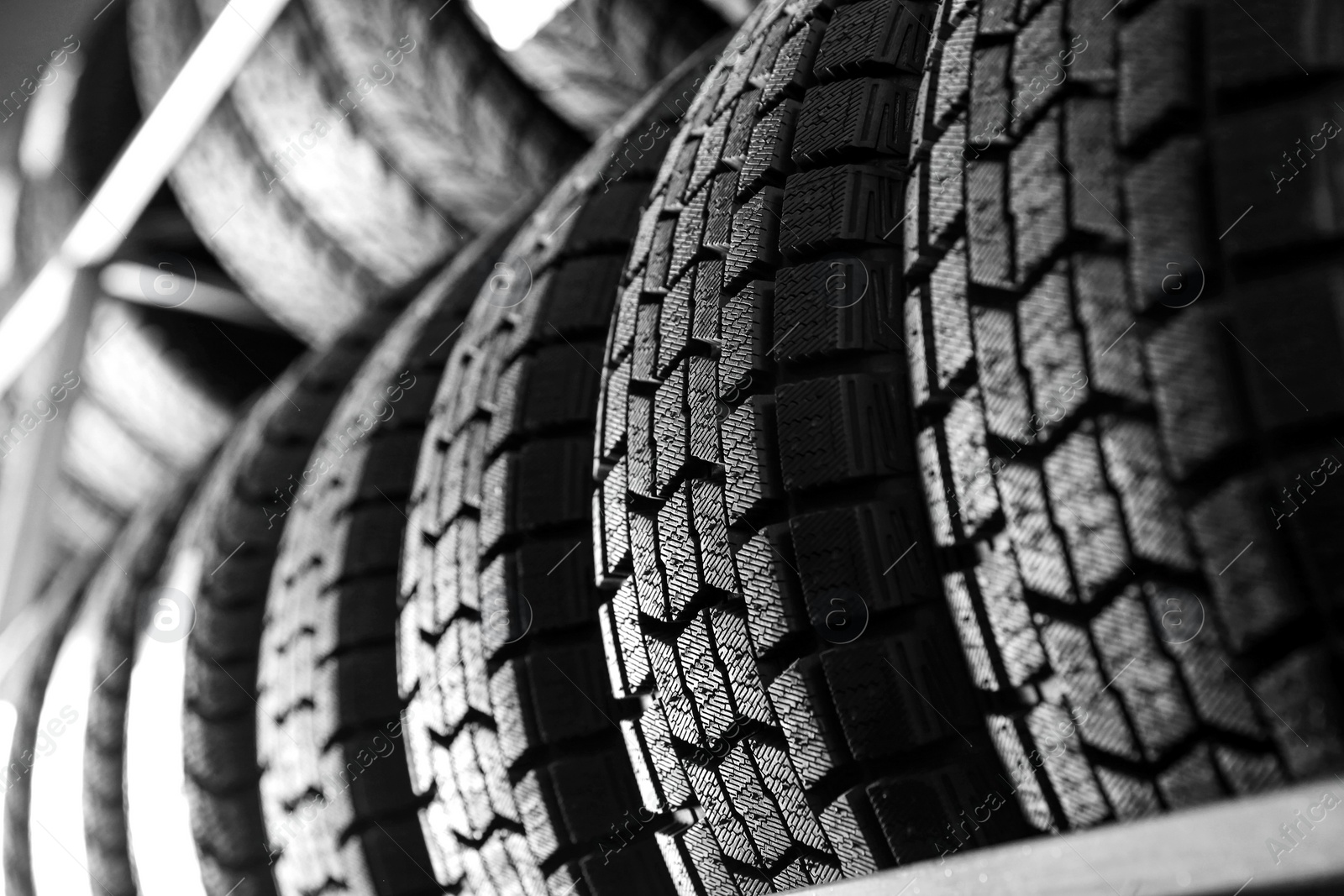 Photo of Car tires in automobile service center, closeup