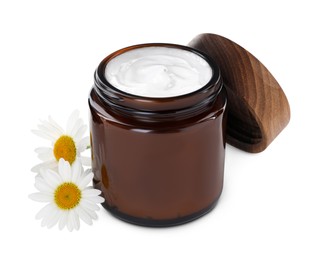 Photo of Jar of hand cream and chamomiles on white background