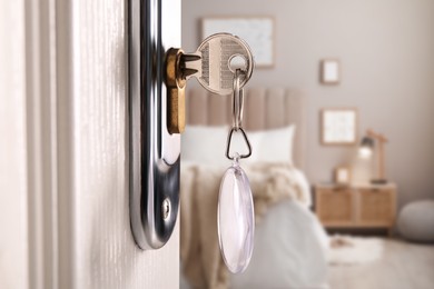 Image of Closeup view of door with key open in bedroom 