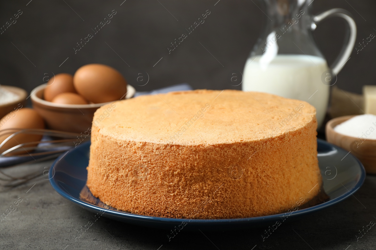 Photo of Delicious fresh homemade cake on grey marble table