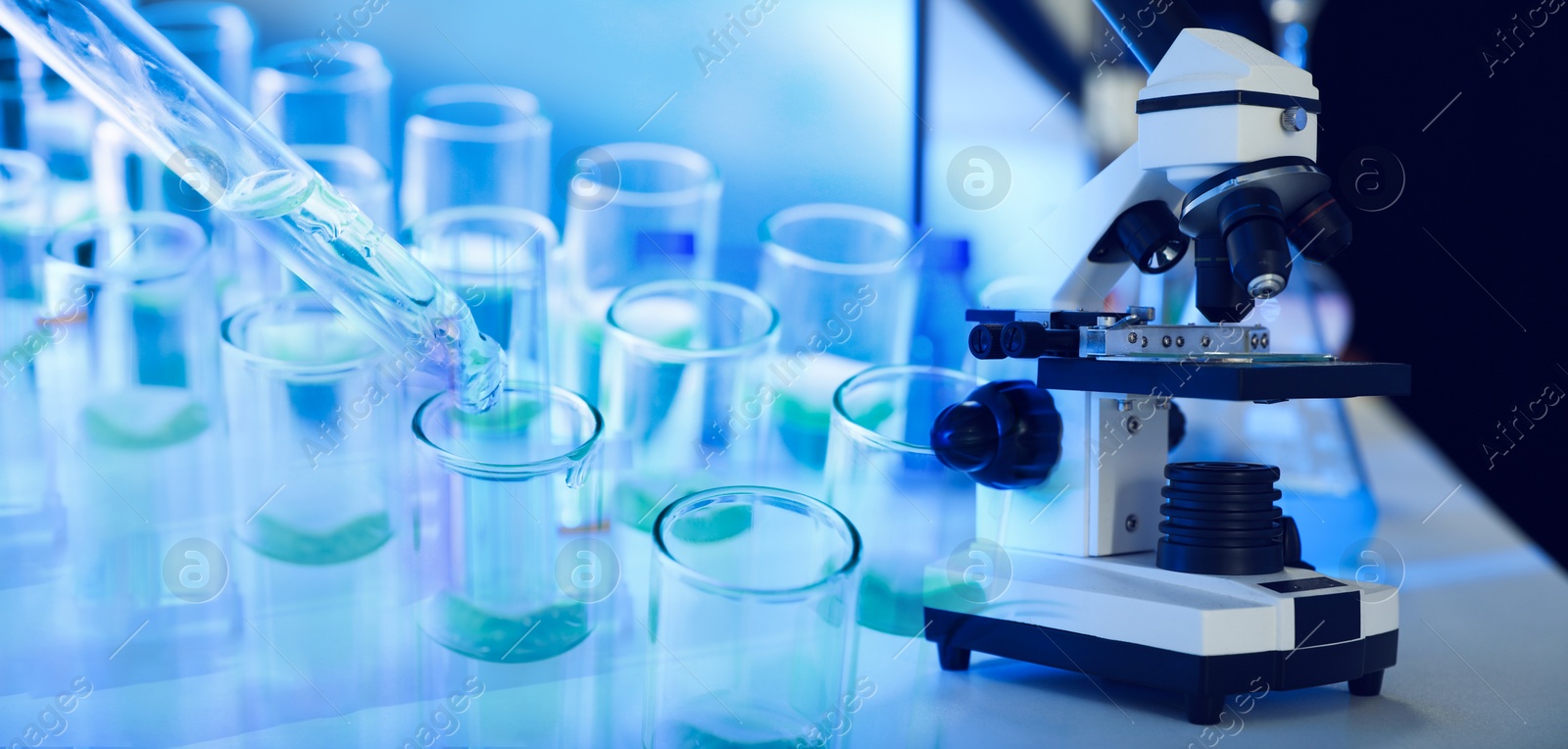 Image of Double exposure of test tubes with samples and microscope, banner design. Laboratory analysis