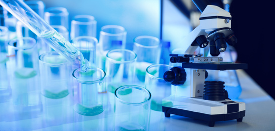 Image of Double exposure of test tubes with samples and microscope, banner design. Laboratory analysis