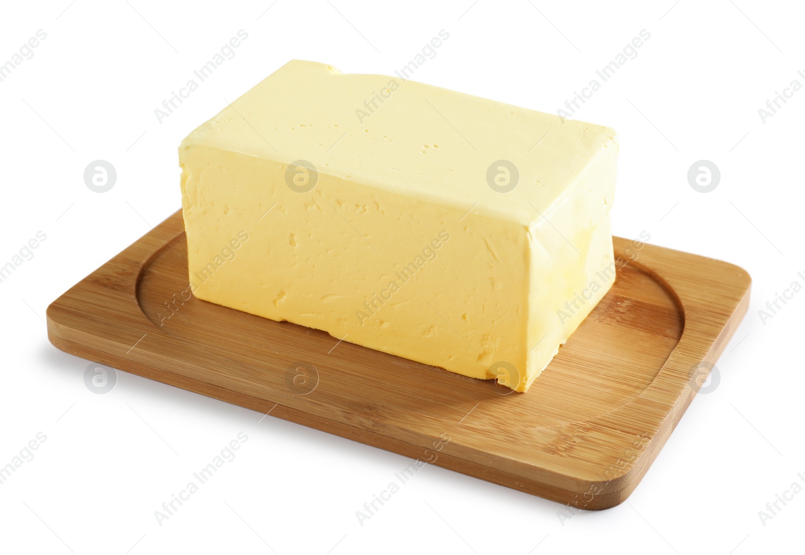 Photo of Wooden board with block of fresh butter on white background