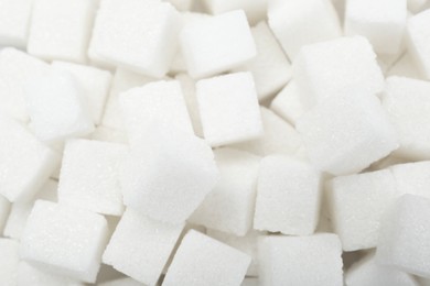 White sugar cubes as background, top view