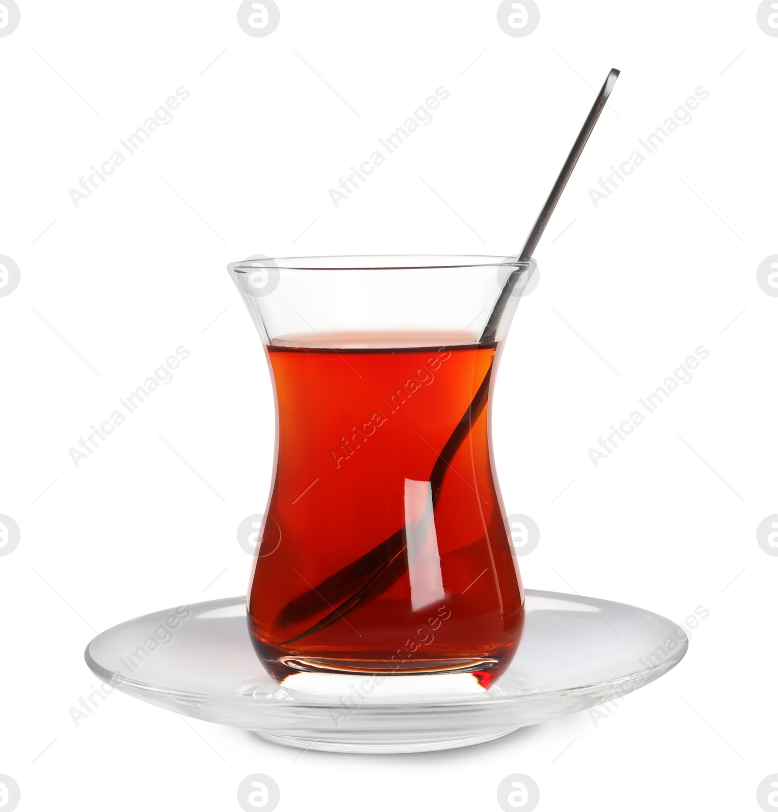 Photo of Glass of traditional Turkish tea with spoon isolated on white