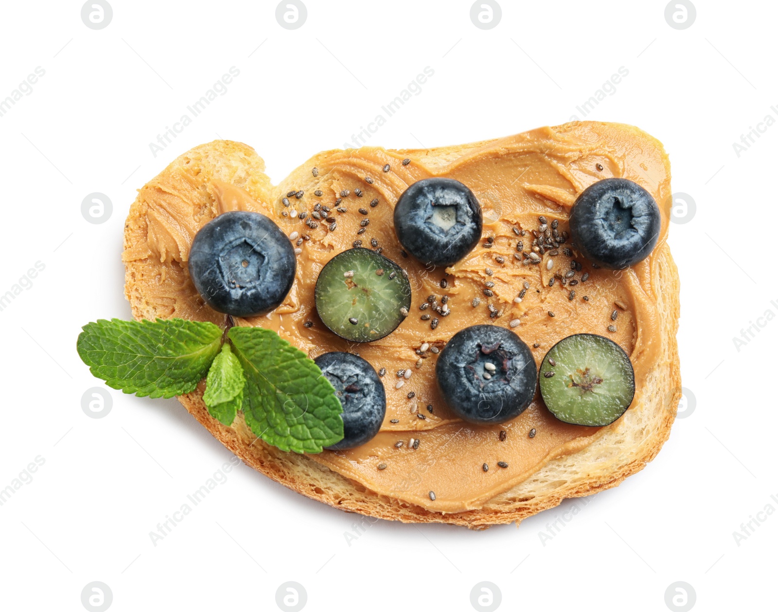 Photo of Tasty toast with blueberries, peanut butter and chia seeds on white background, top view