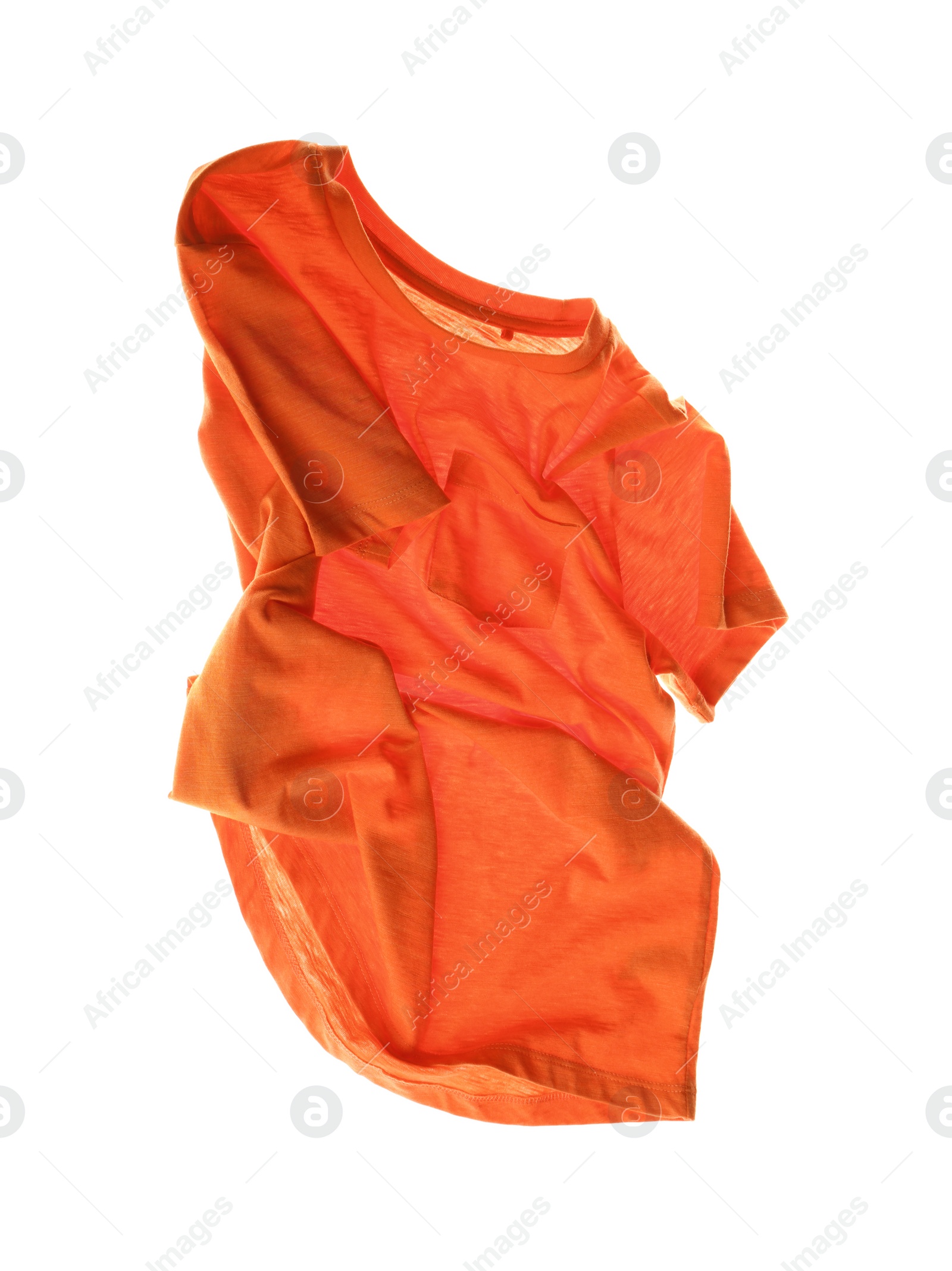 Photo of Rumpled orange t-shirt isolated on white. Messy clothes