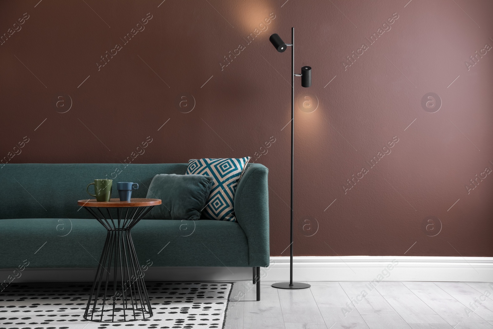 Photo of Stylish living room interior with comfortable sofa and floor lamp