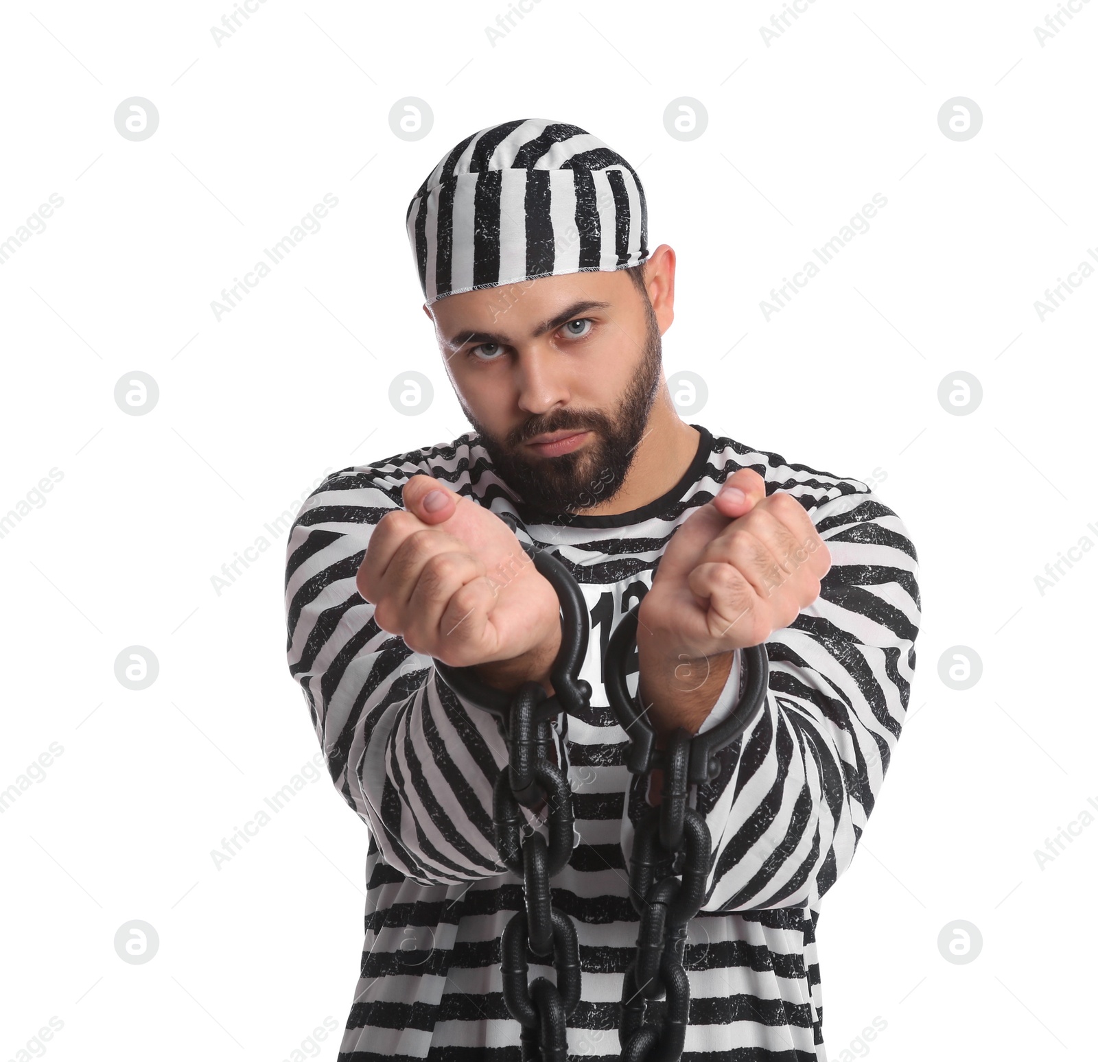 Photo of Prisoner in special uniform with chained hands on white background