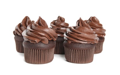 Delicious chocolate cupcakes with cream on white background