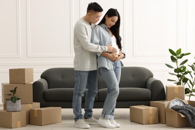 Pregnant woman and her husband in their new apartment
