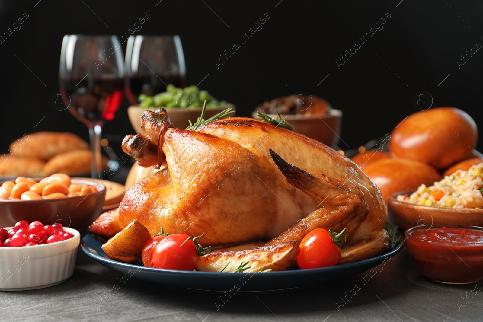 Photo of Traditional festive dinner with delicious roasted turkey served on table