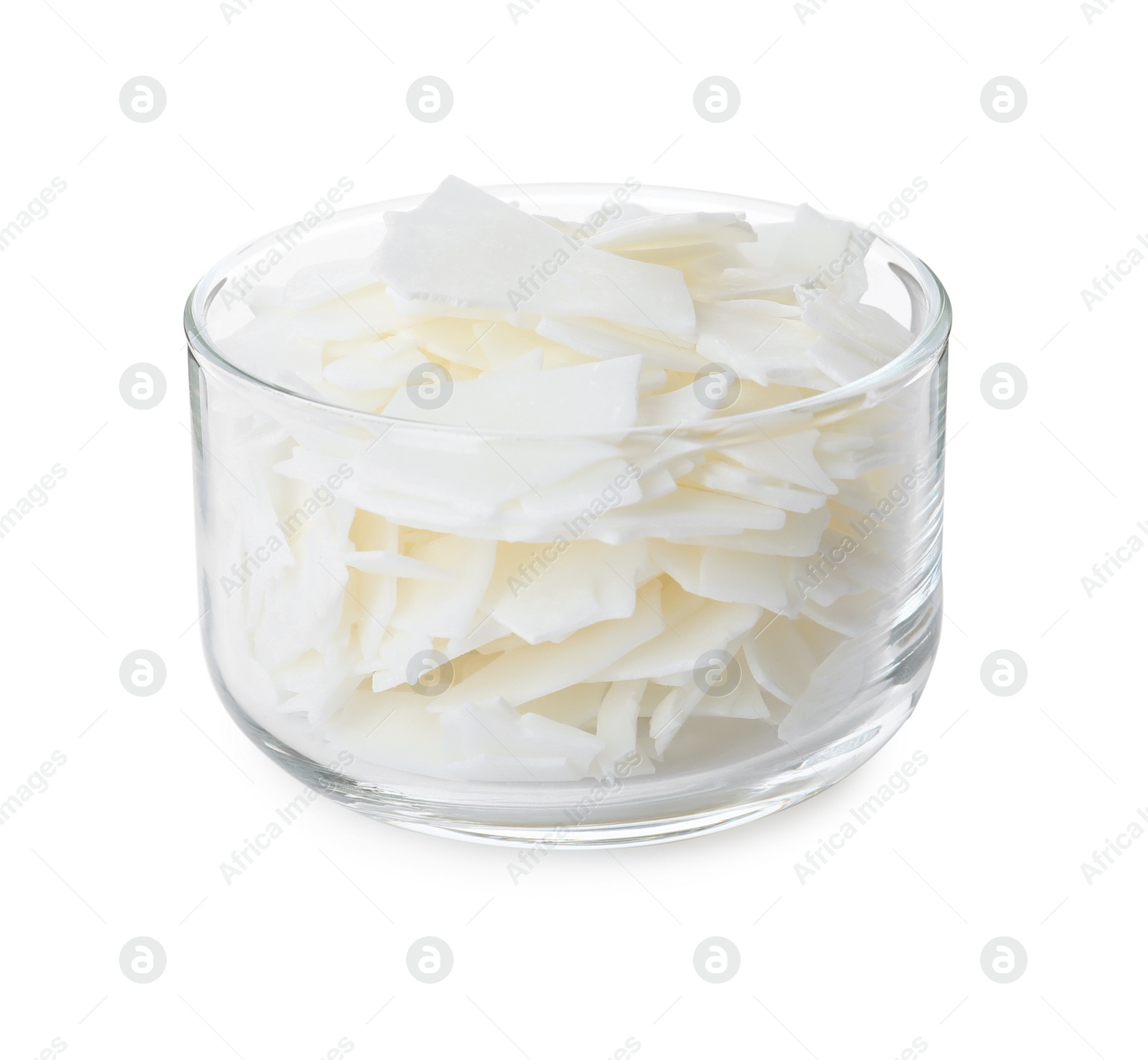 Photo of Wax flakes in glass bowl on white background. Homemade candle material