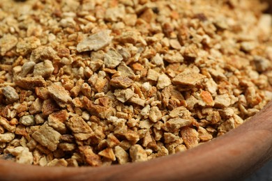 Bowl of dried orange zest seasoning, closeup