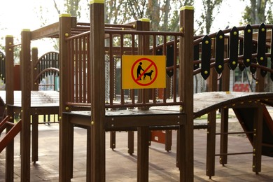 Image of Sign NO DOGS ALLOWED at children's playground