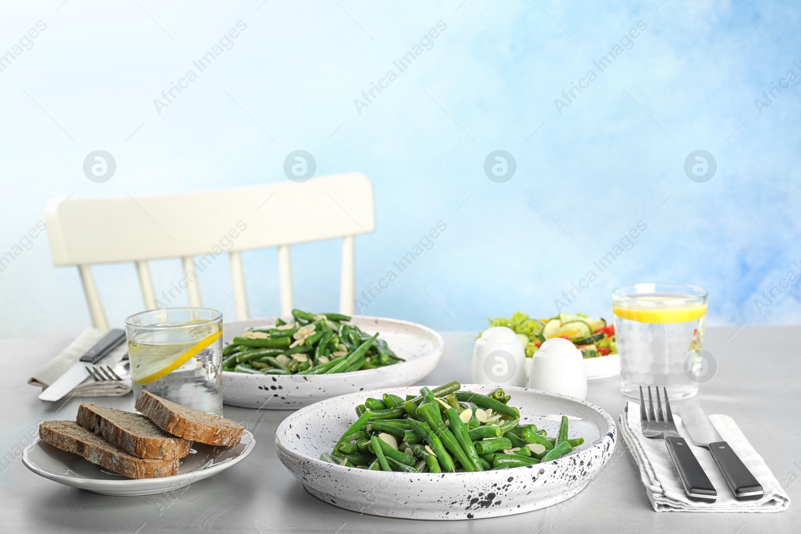 Photo of Tasty green beans with almonds served for dinner on table