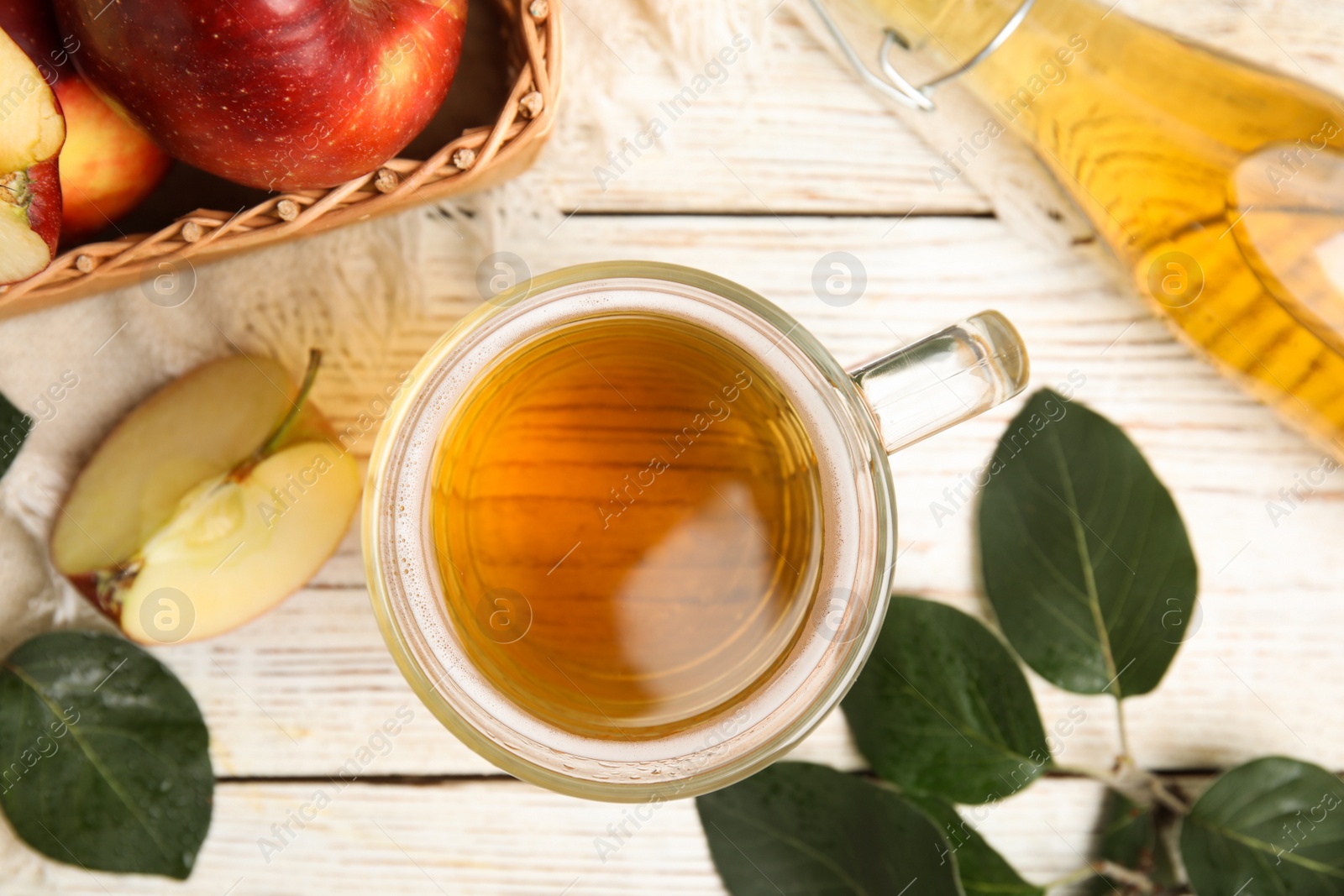 Photo of Flat lay composition with delicious apple cider on white wooden table