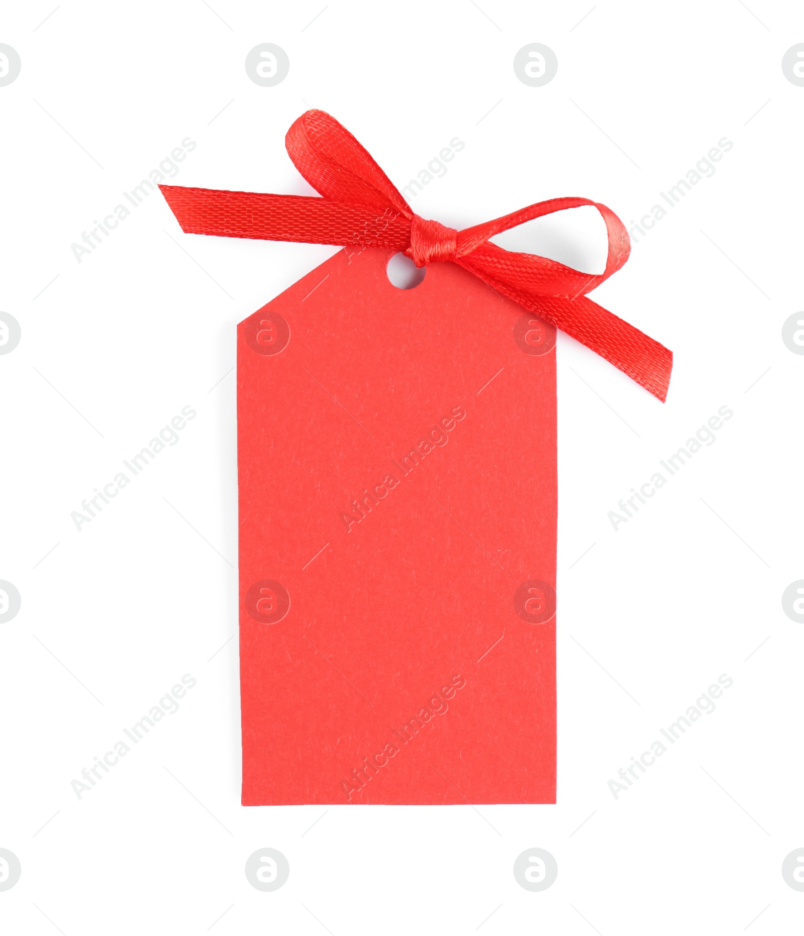 Photo of Blank red gift tag with satin ribbon on white background, top view