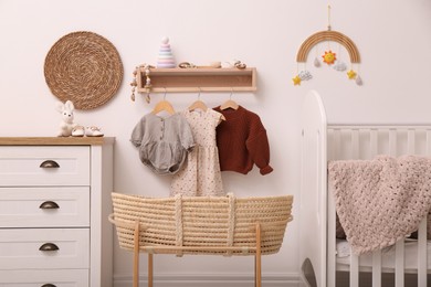 Photo of Nursery interior with stylish furniture, clothes and accessories