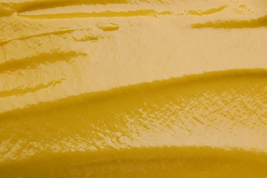 Photo of Texture of delicious mustard as background, top view