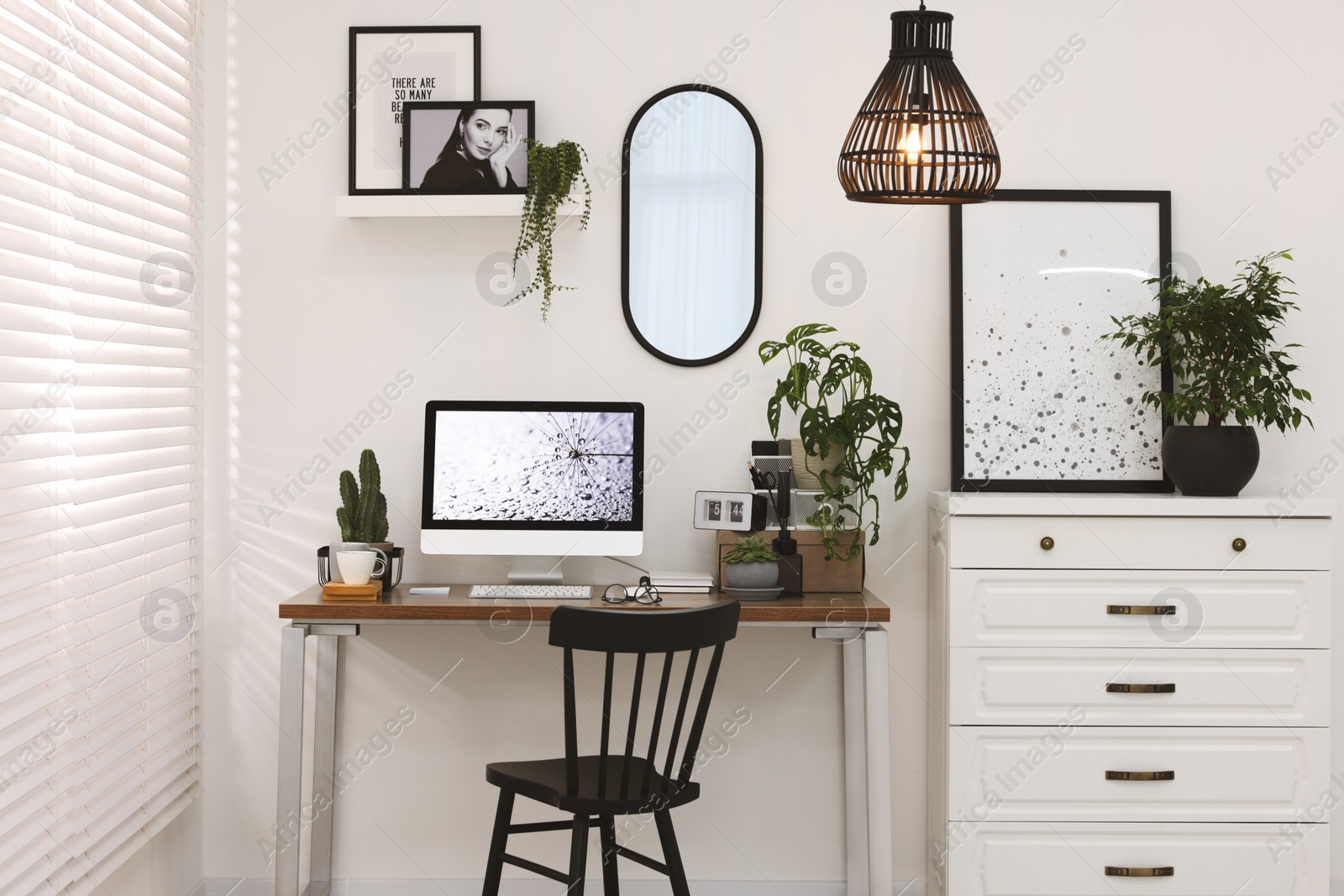 Photo of Cozy workspace with computer on wooden desk at home