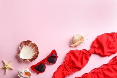 Photo of Flat lay composition with beach accessories on color background. Space for text