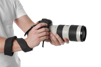 Photo of Photographer holding modern camera on white background, closeup