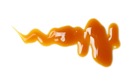 Photo of Delicious caramel sauce on white background