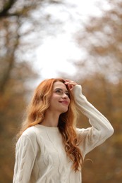 Photo of Autumn vibes. Portrait of beautiful woman outdoors. Space for text
