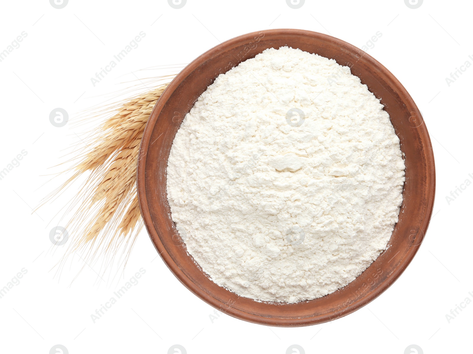 Photo of Organic flour and spikelets isolated on white, top view