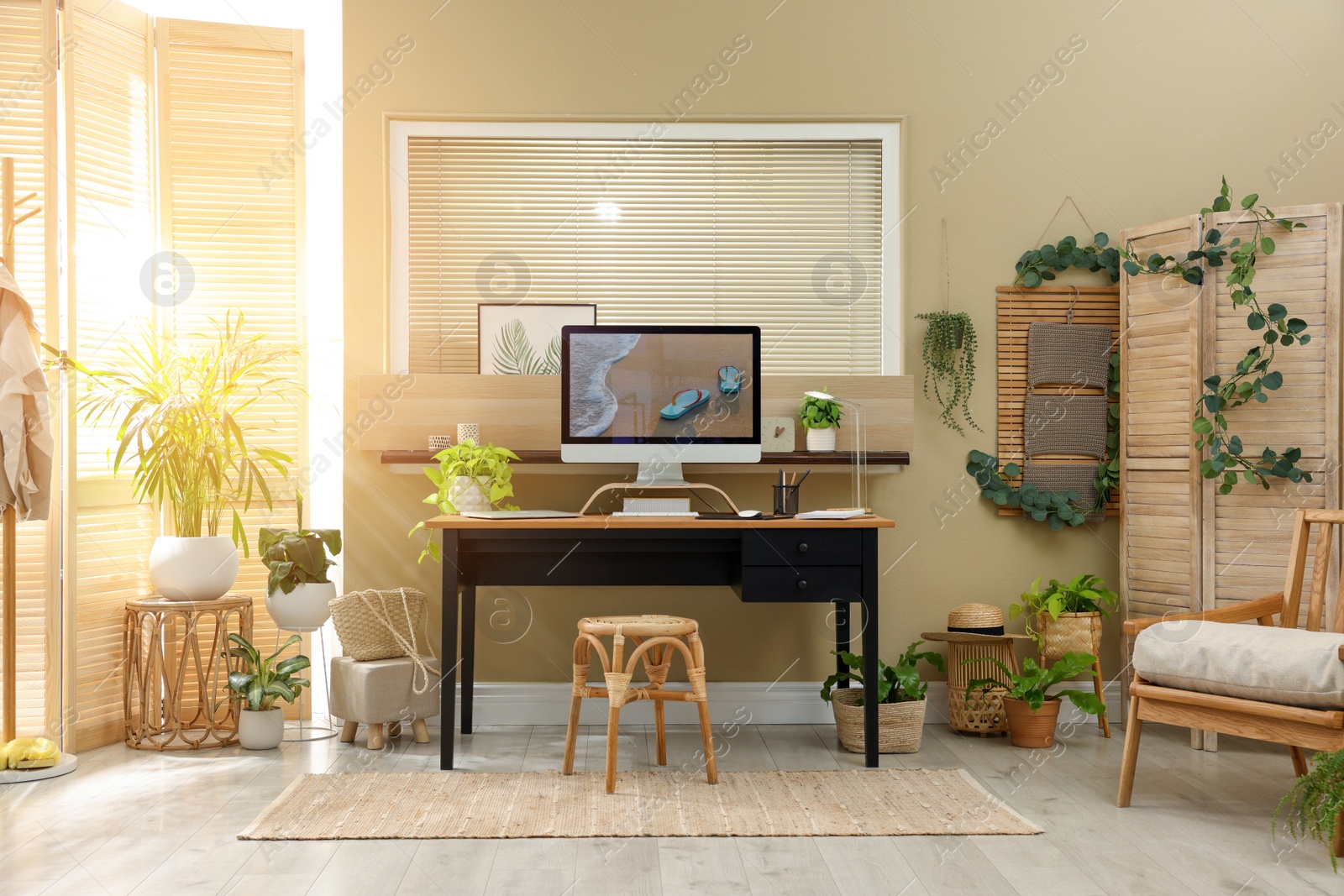 Photo of Light room interior with comfortable workplace near window